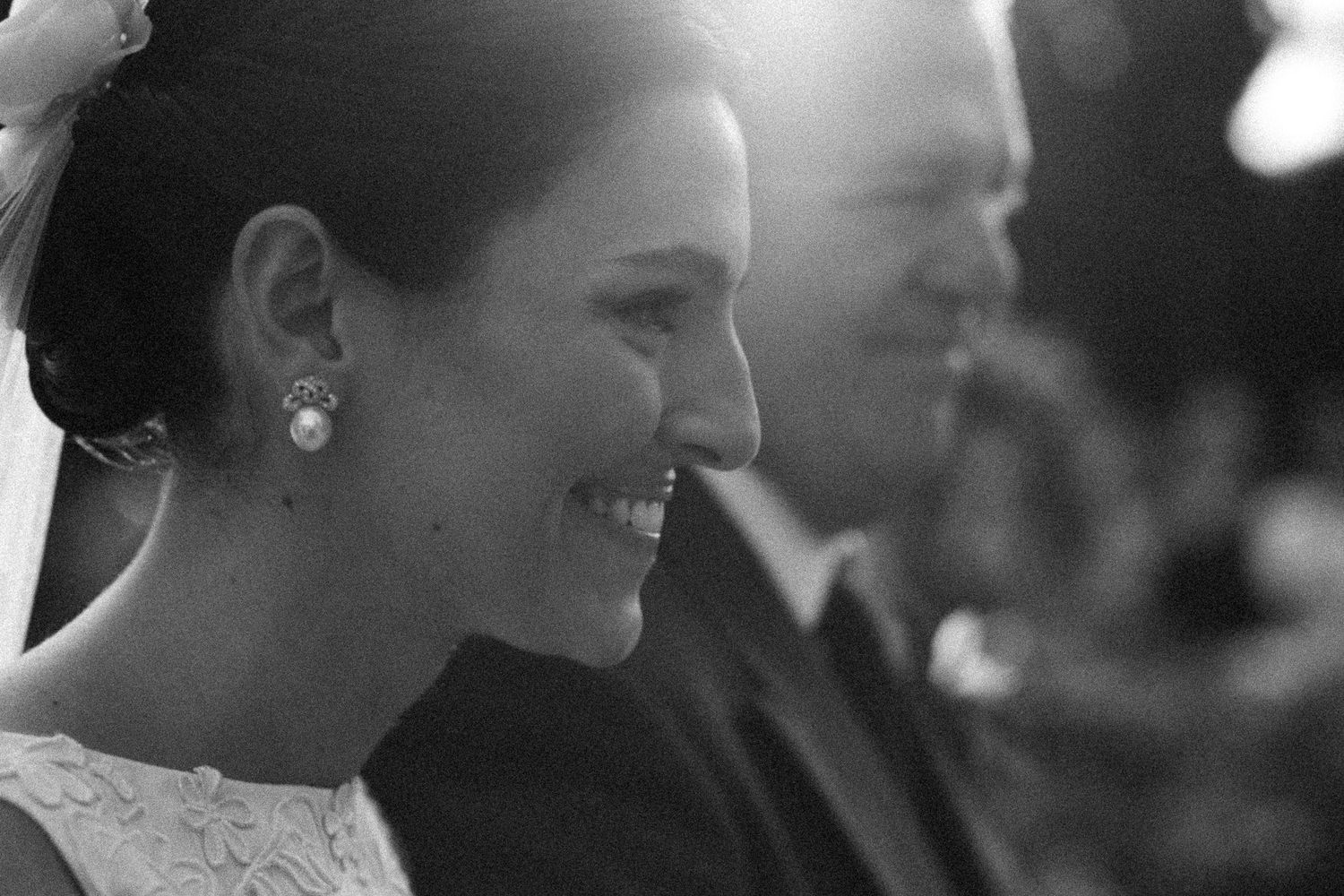A happy couple shares an intimate moment while dancing together at their wedding reception.
