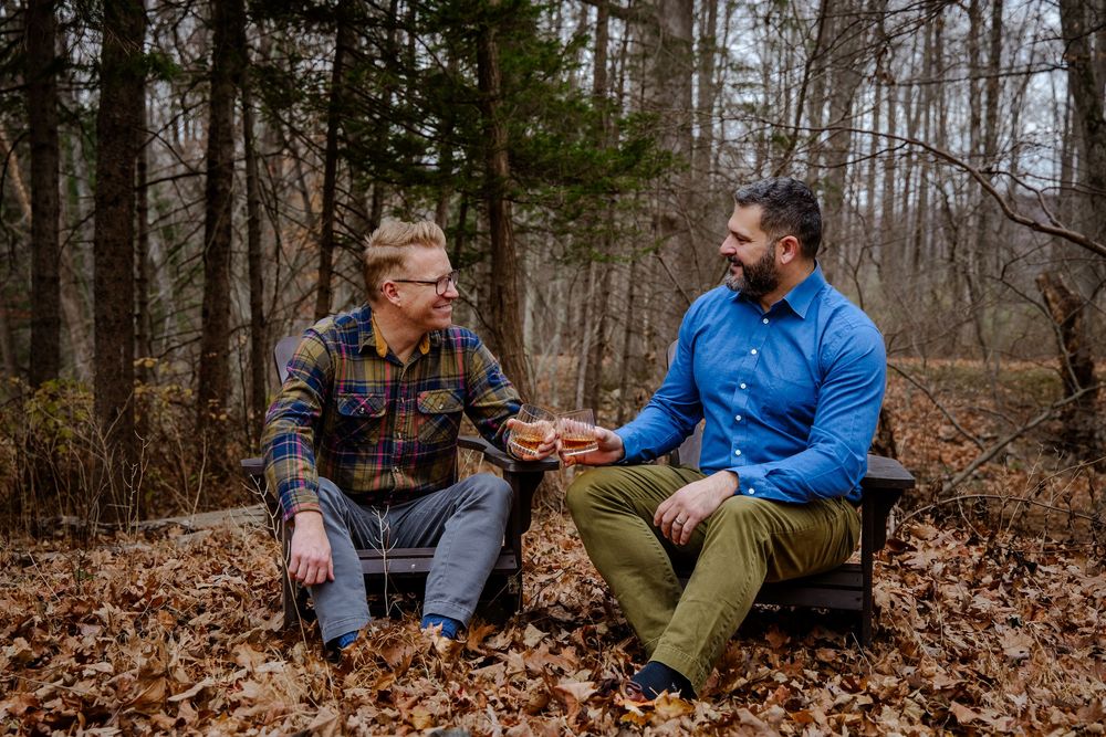Two people sharing a moment in love amongst the fall foliage in Autumn