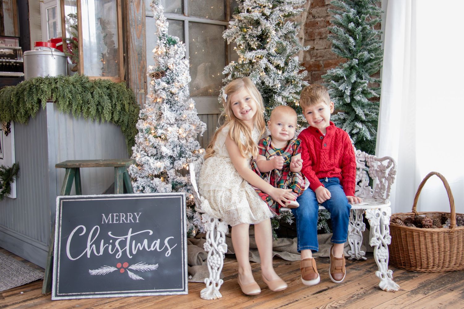 Family of five Christmas photos in Cincinnati with mom, dad, son, and two daughters during a cozy holiday studio session