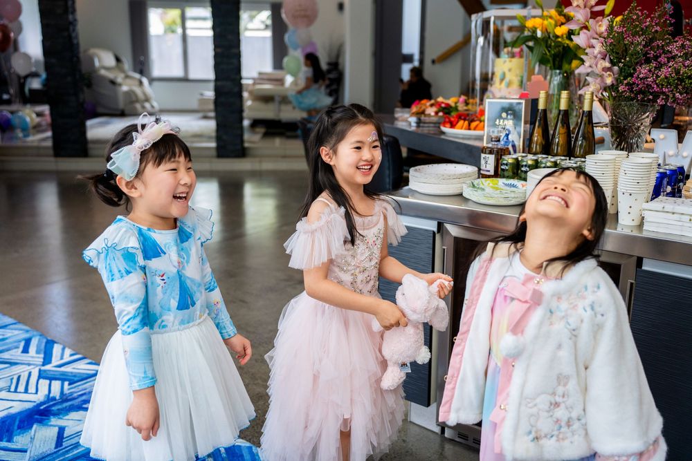 Auckland kids party photography capturing face painting activities and beautiful party food details.