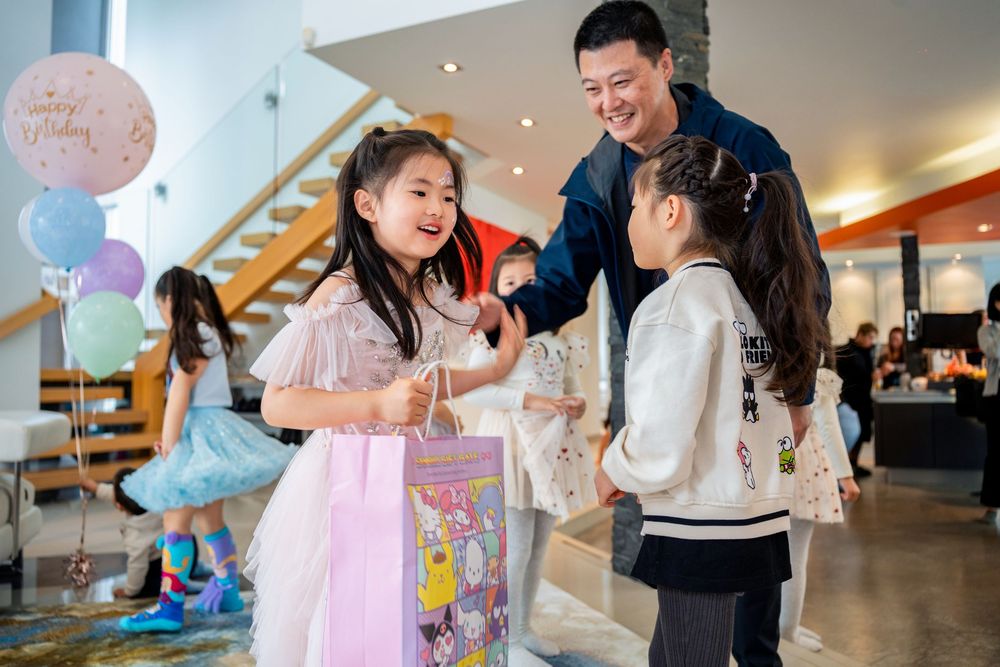 Auckland kids party photography capturing face painting activities and beautiful party food details.