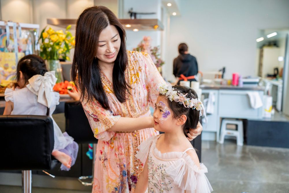 Two happy girls in beautiful princess dresses celebrating at a kids birthday party on the North Shore, Auckland.