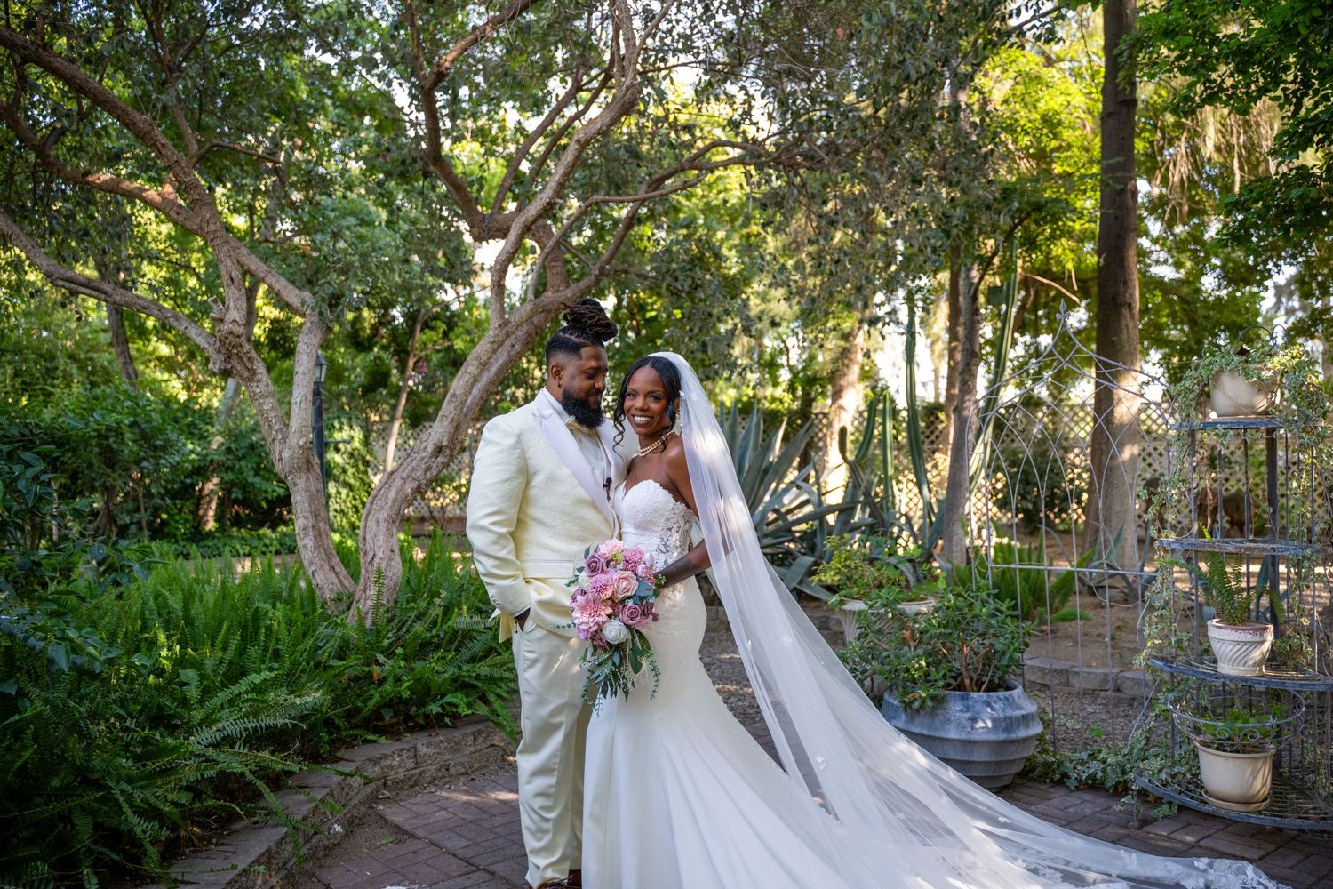 A garden wedding photo session with lush greenery and natural lighting.