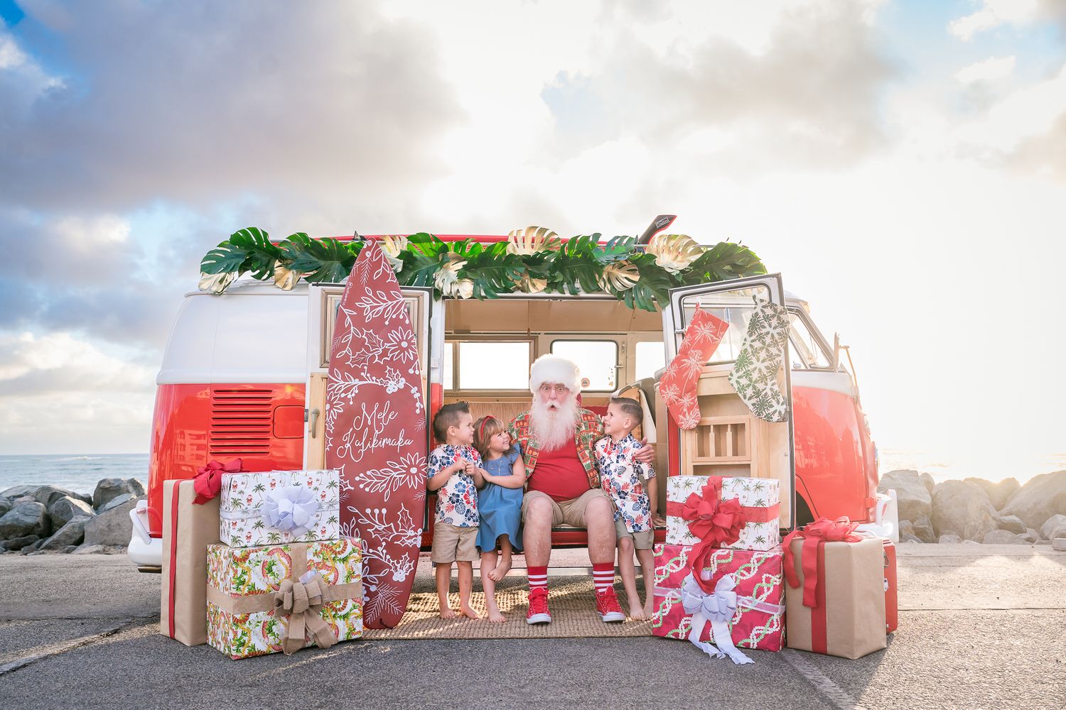 A unique holiday mini session photoshoot with a Hawaiian beach themed Santa in Danta Point, CA by Chaotic Perfection Photography