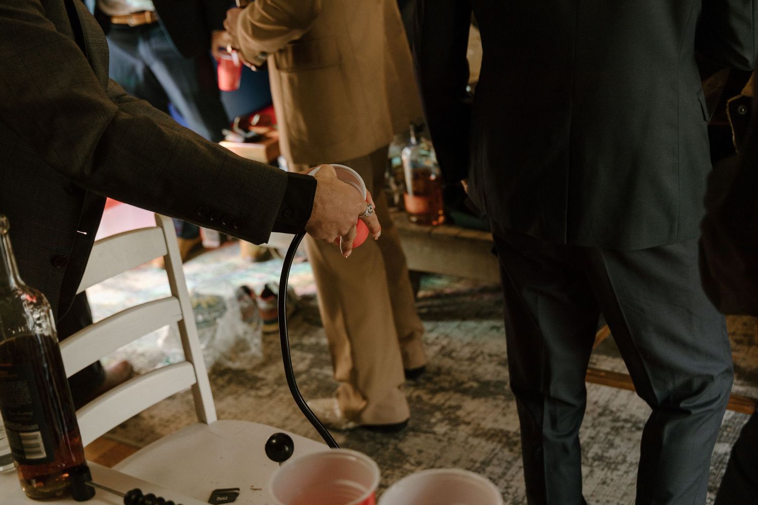 Well-dressed attendees mingle and socialize at an indoor business networking or social event.