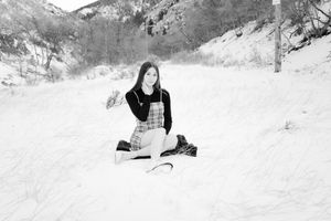 Winter portrait session in snowy mountain landscape.
