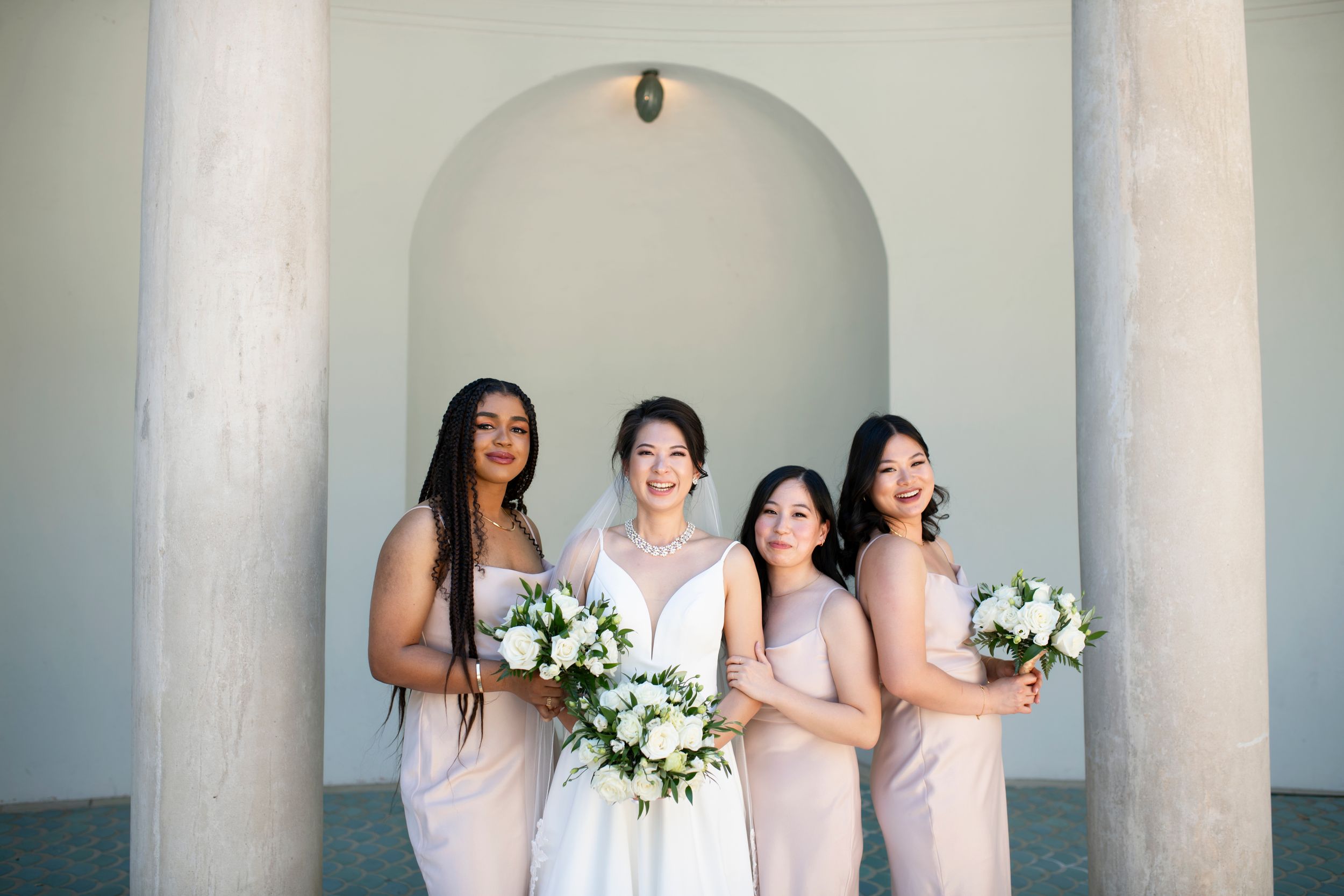 Bride poses with her bridesmaids at Hacienda de las Flores in Moraga.
