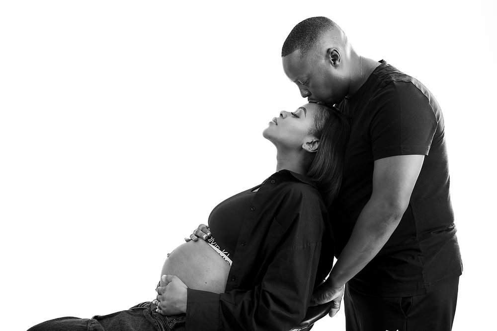 Black and white photo series showing stages of a couple embracing and dancing together against a white background.