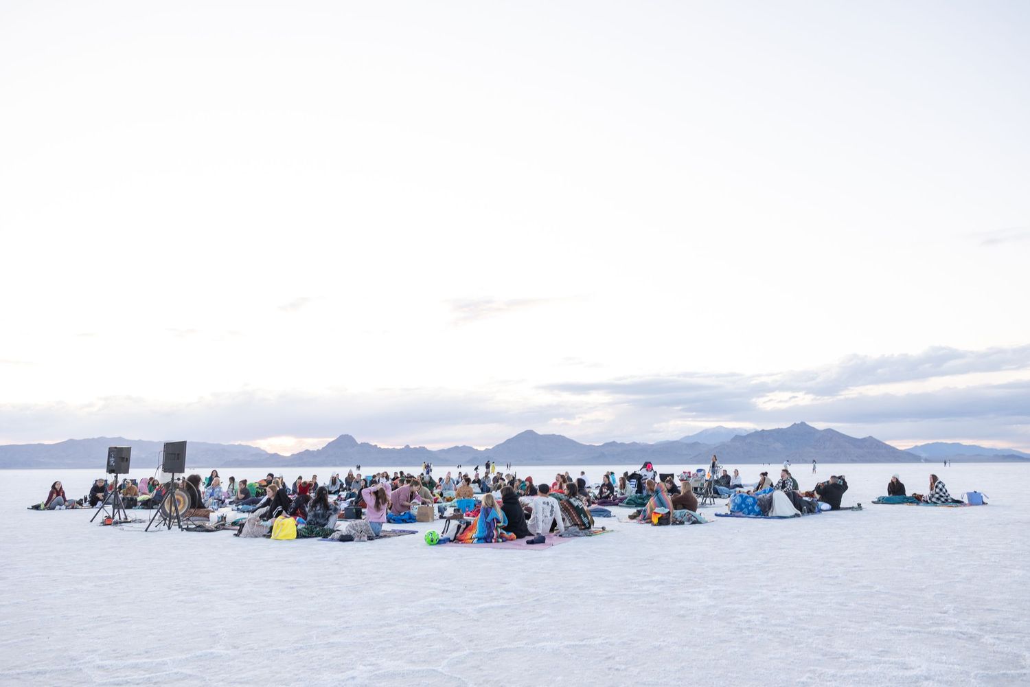 A large group gathers on the salt flats for a sound bath for Norkova SLC.