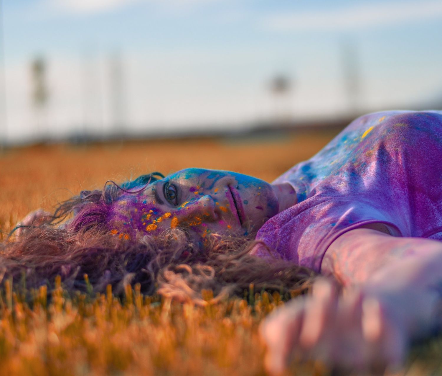 Abstract landscape photography with purple and orange sunset tones creating a dreamy horizon.