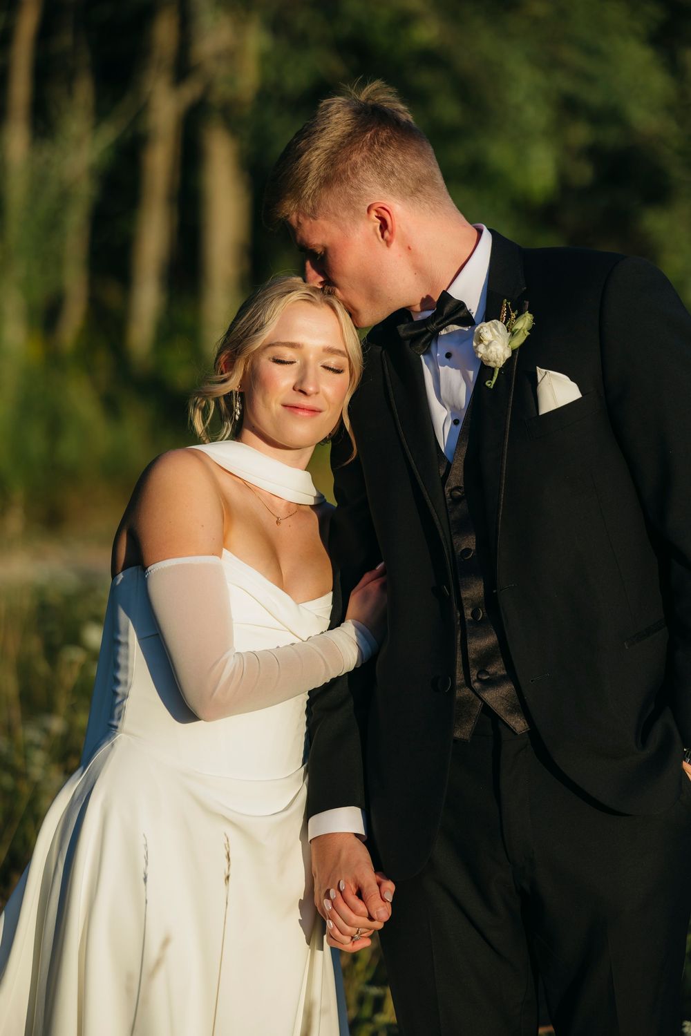 A romantic wedding couple shares intimate moments in a series of sunset portraits against a natural outdoor backdrop.