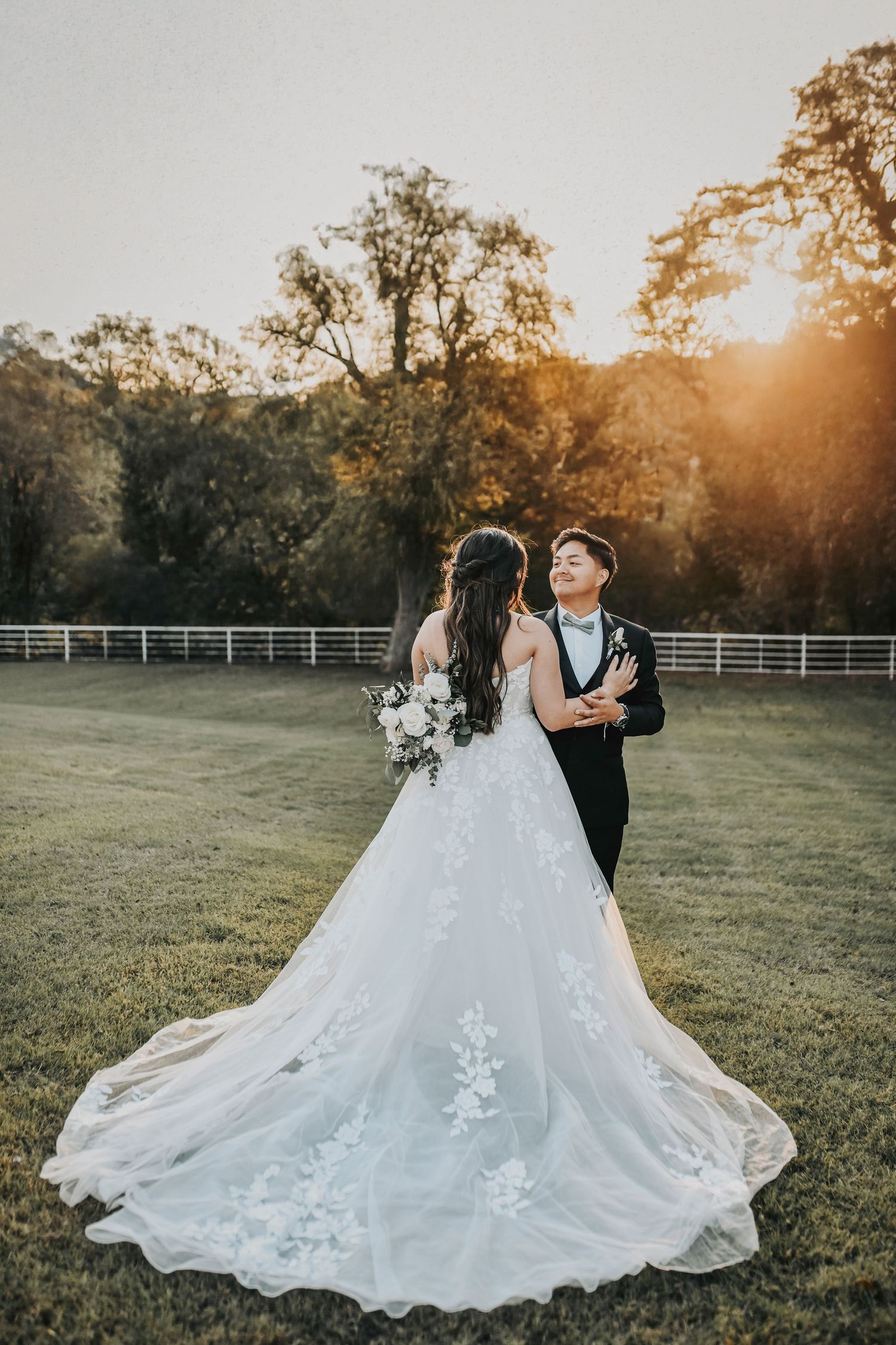 Newlyweds walking together during golden hour portraits