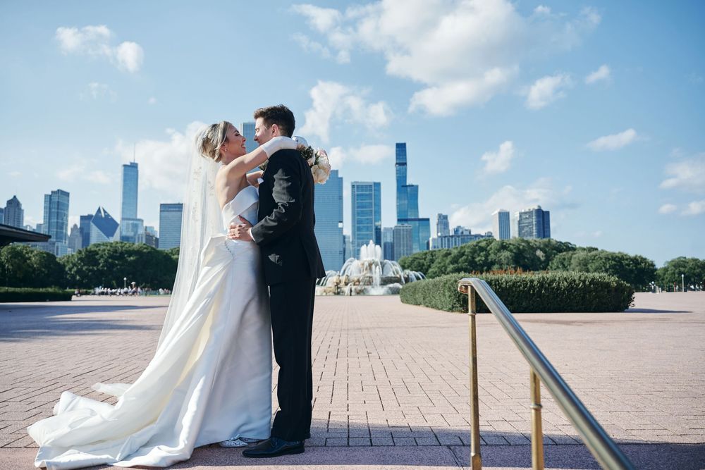A romantic wedding photo sequence showing a couple against a city skyline backdrop in Chicago's Grant Park.