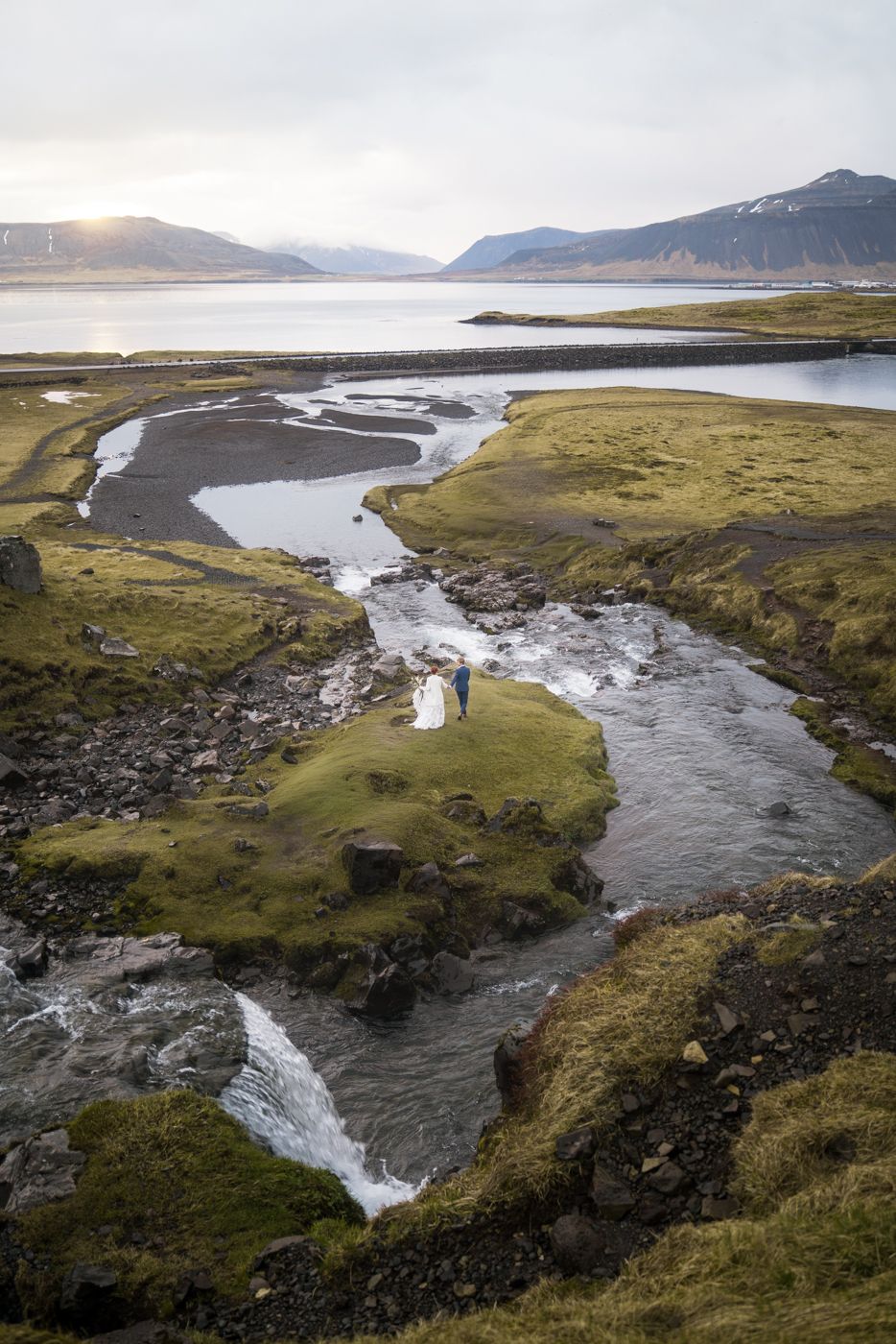 Couple walking by a river