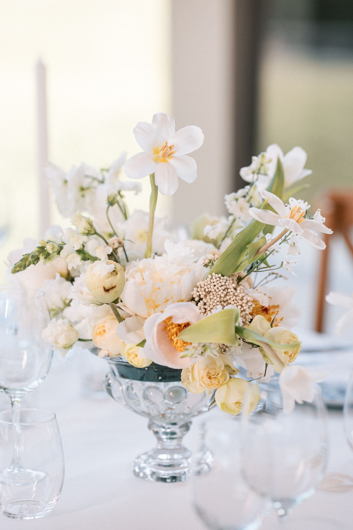 Floral centrepieces in soft white tones at Correio-Mor palace wedding in Portugal