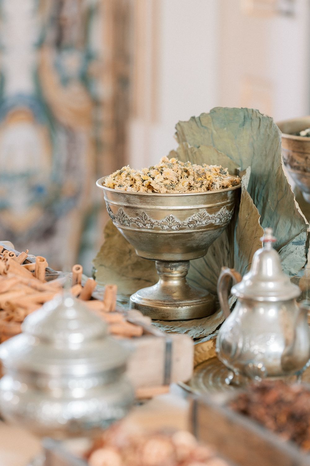 Elegant high tea setup with spices and dried flowers at Palácio do Correio-Mor wedding in Portugal, captured by regina wedding photographer
