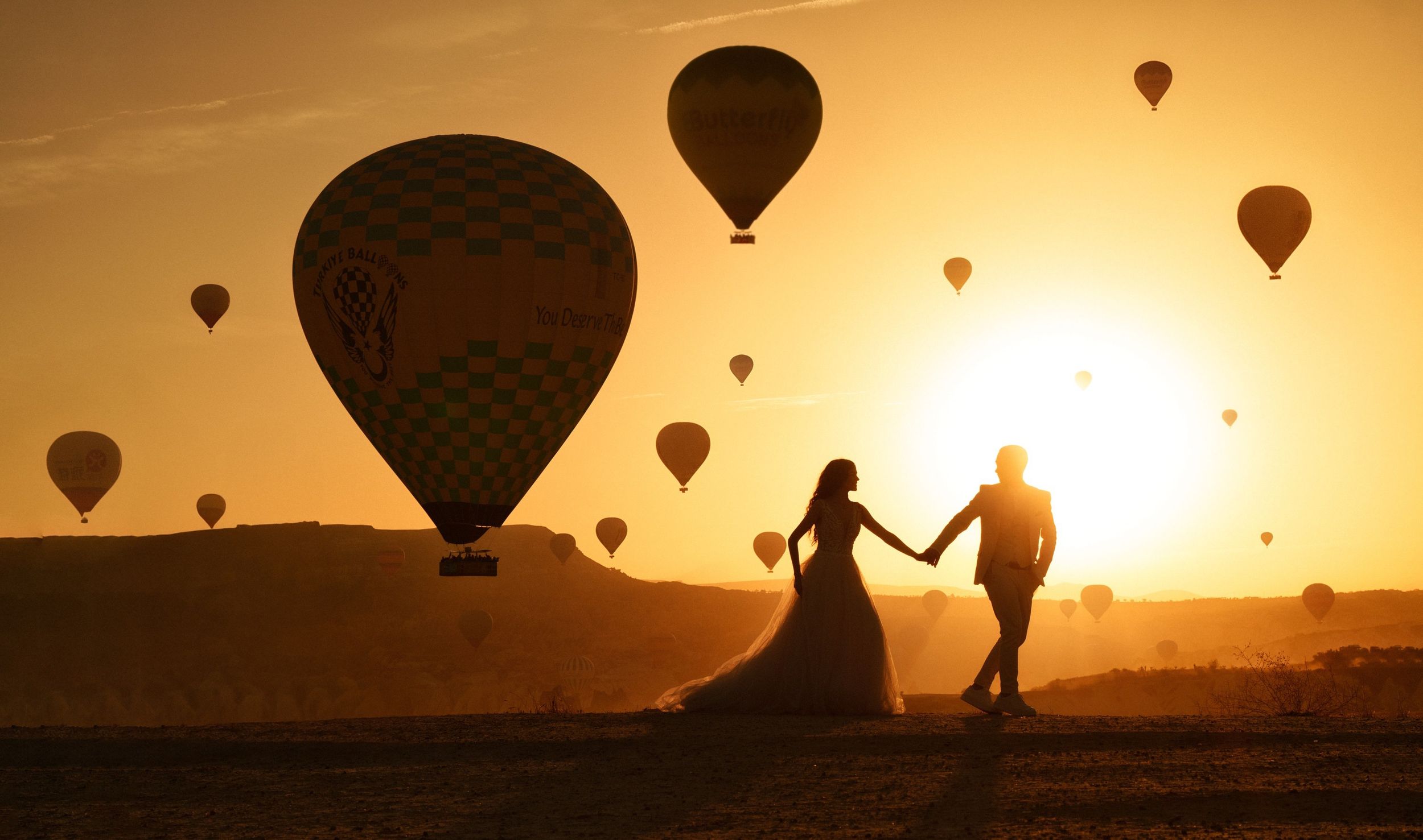 Dramatic wedding photography sequence on red rock formations at sunset.