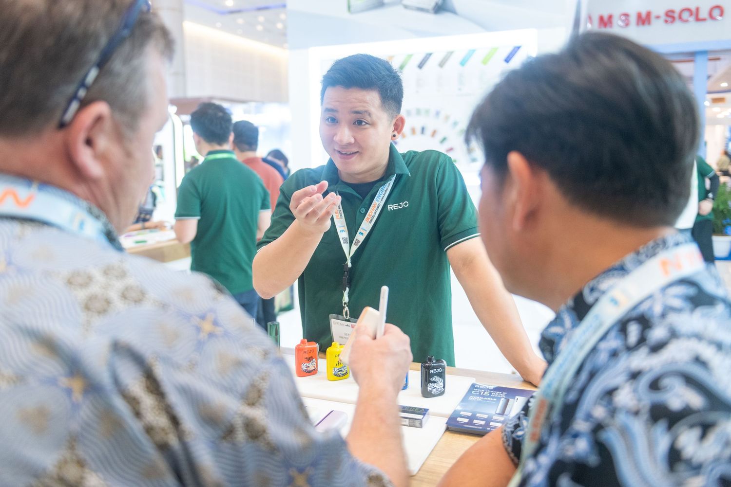 Students gather around a table engaging in group discussion and collaborative learning activities.