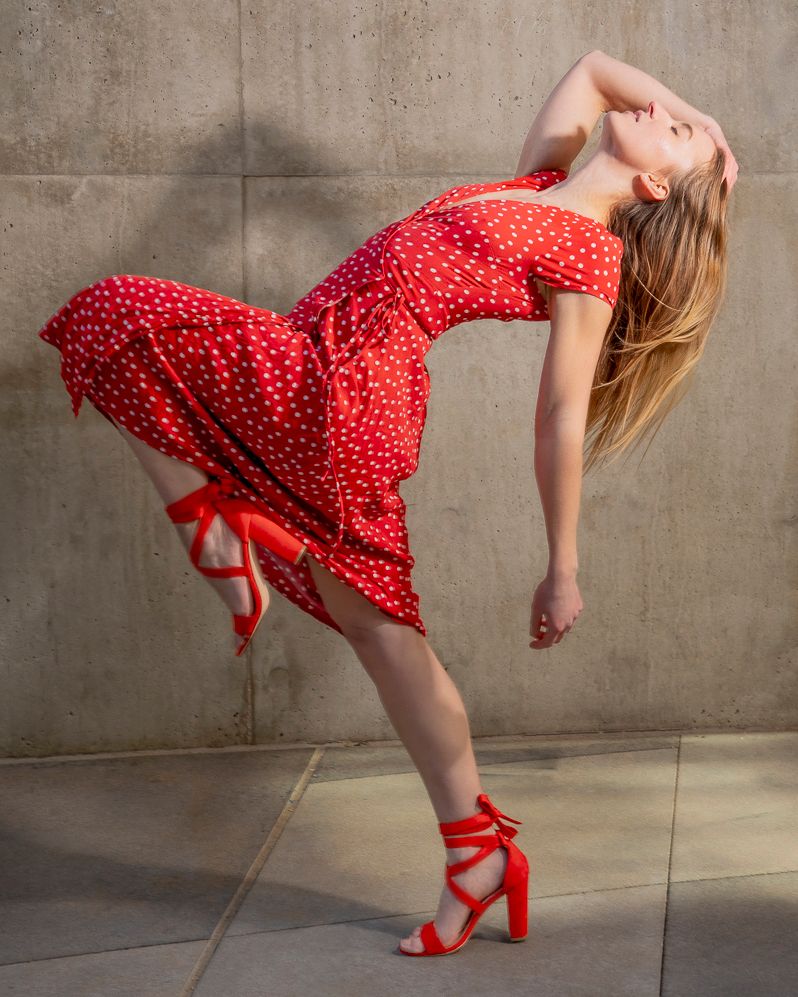 Portrait photography featuring a model in a red dress and red heels, created by commercial photographer Chris Z of Zeng Studio.