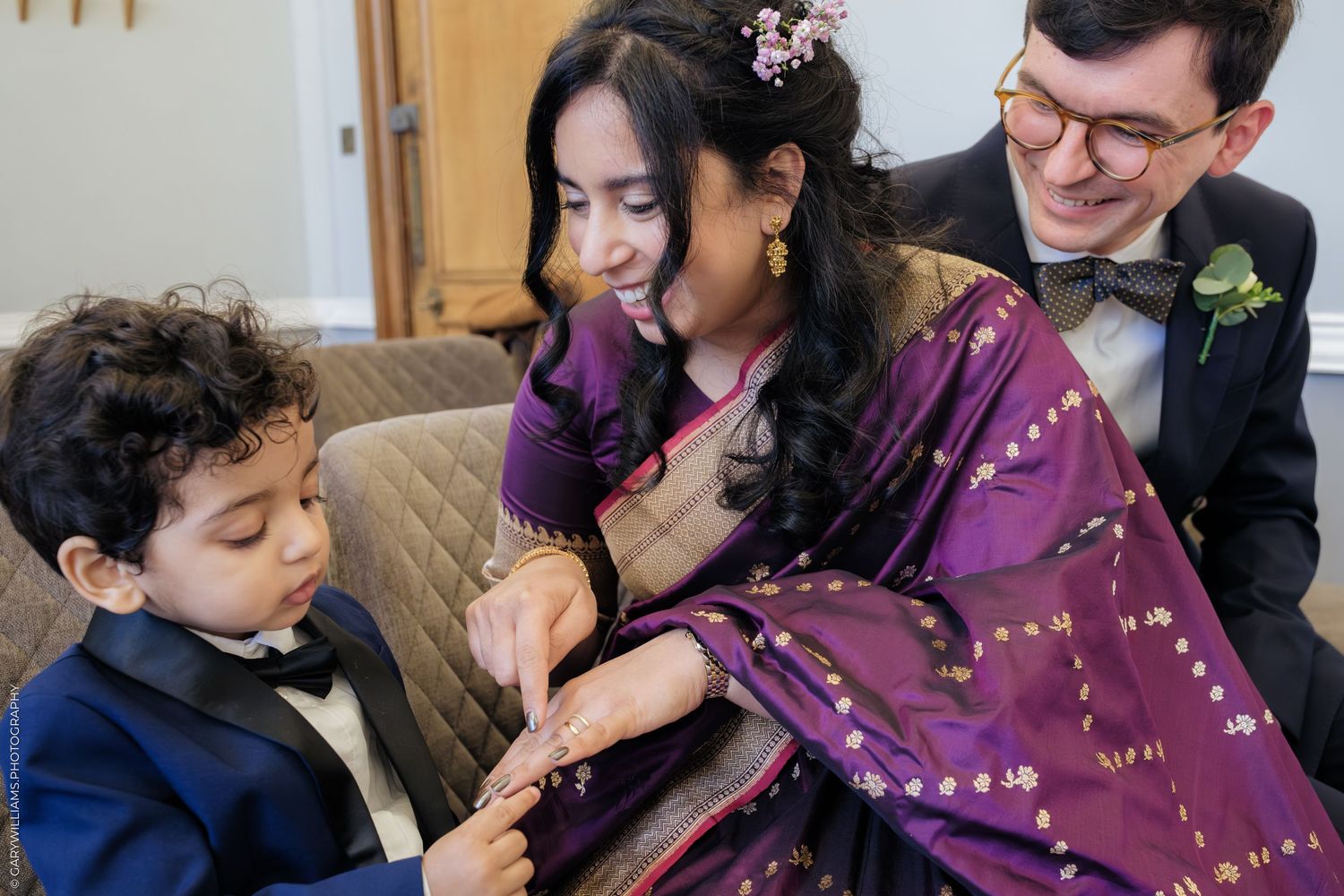 A sequence of photos shows a child and adult sharing a tender moment while looking at a mobile device together.