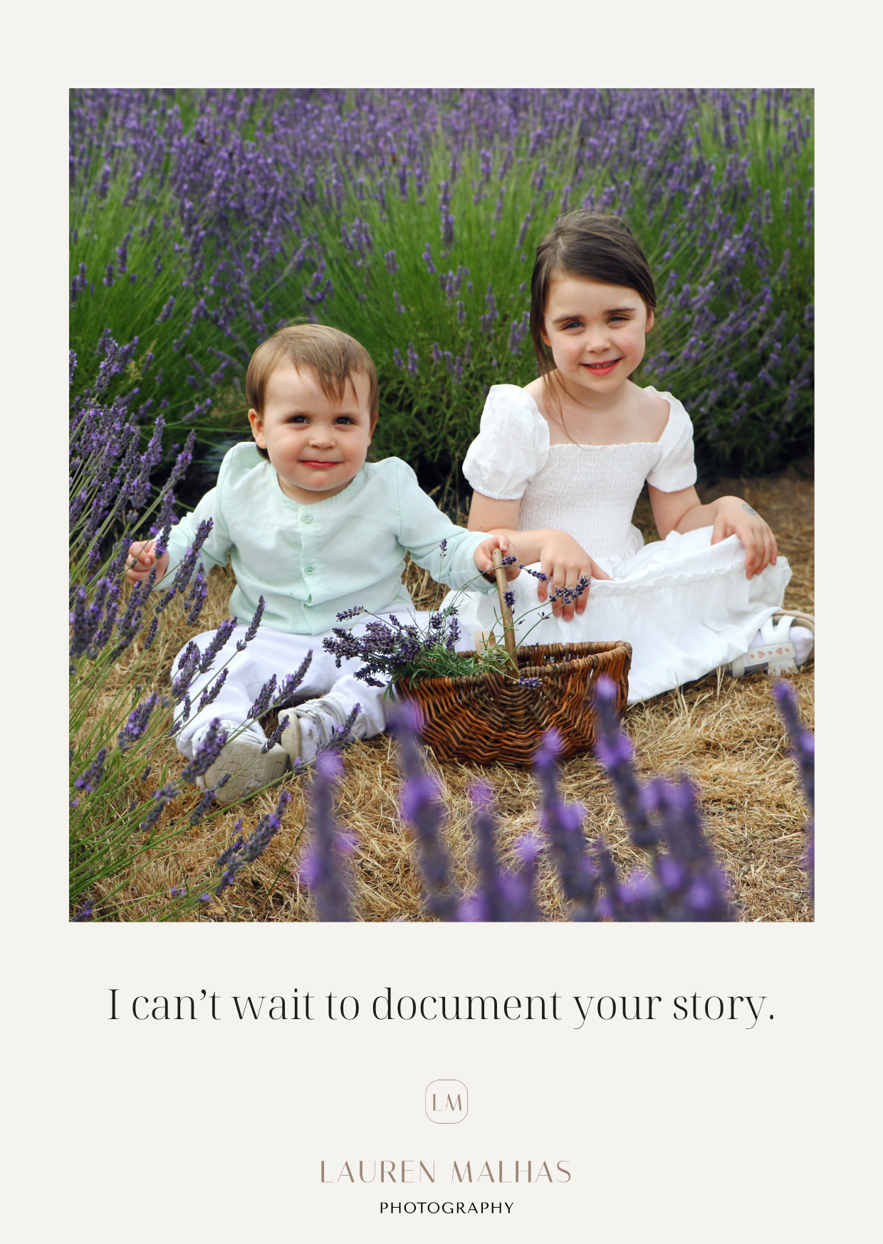 Three children sit together in white outfits among blooming purple lavender flowers in an outdoor garden setting.