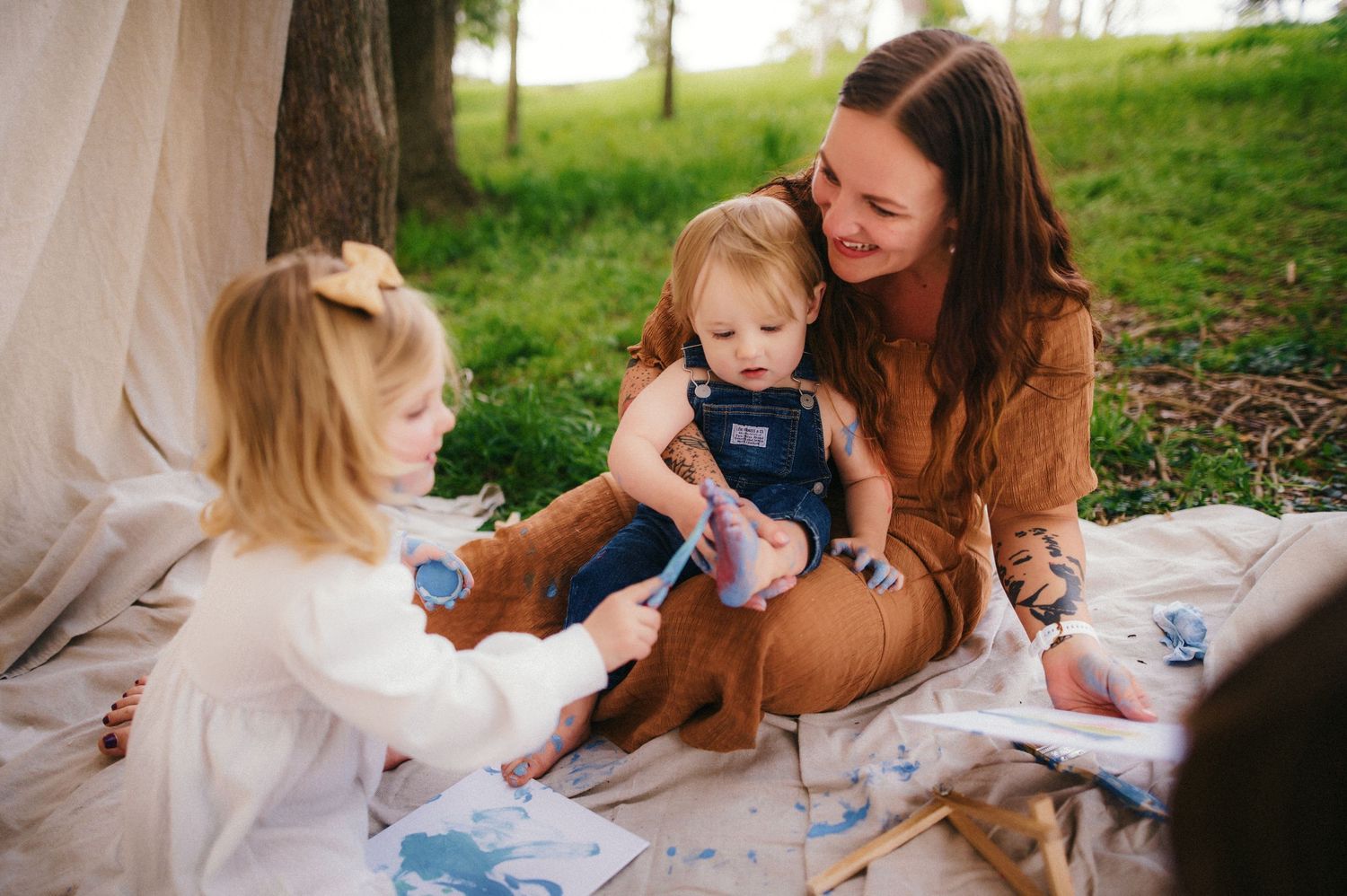 A series of tender family moments captured outdoors in natural light with soft earth tones and gentle interactions.