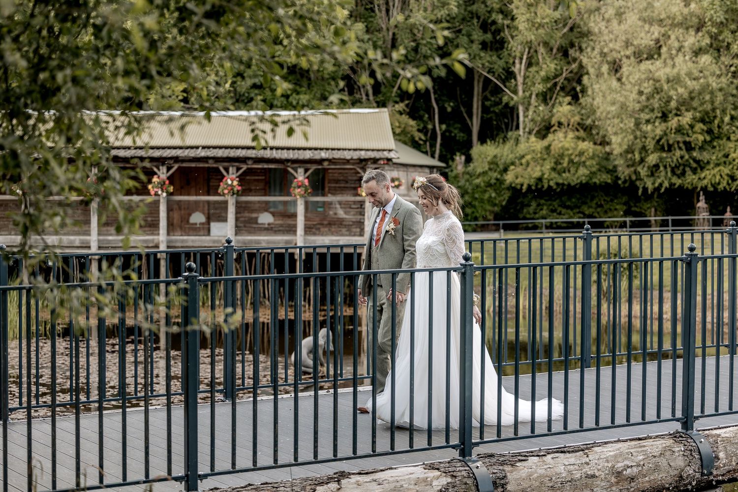 Natural wedding photography of a bride and groom taking a walk.
