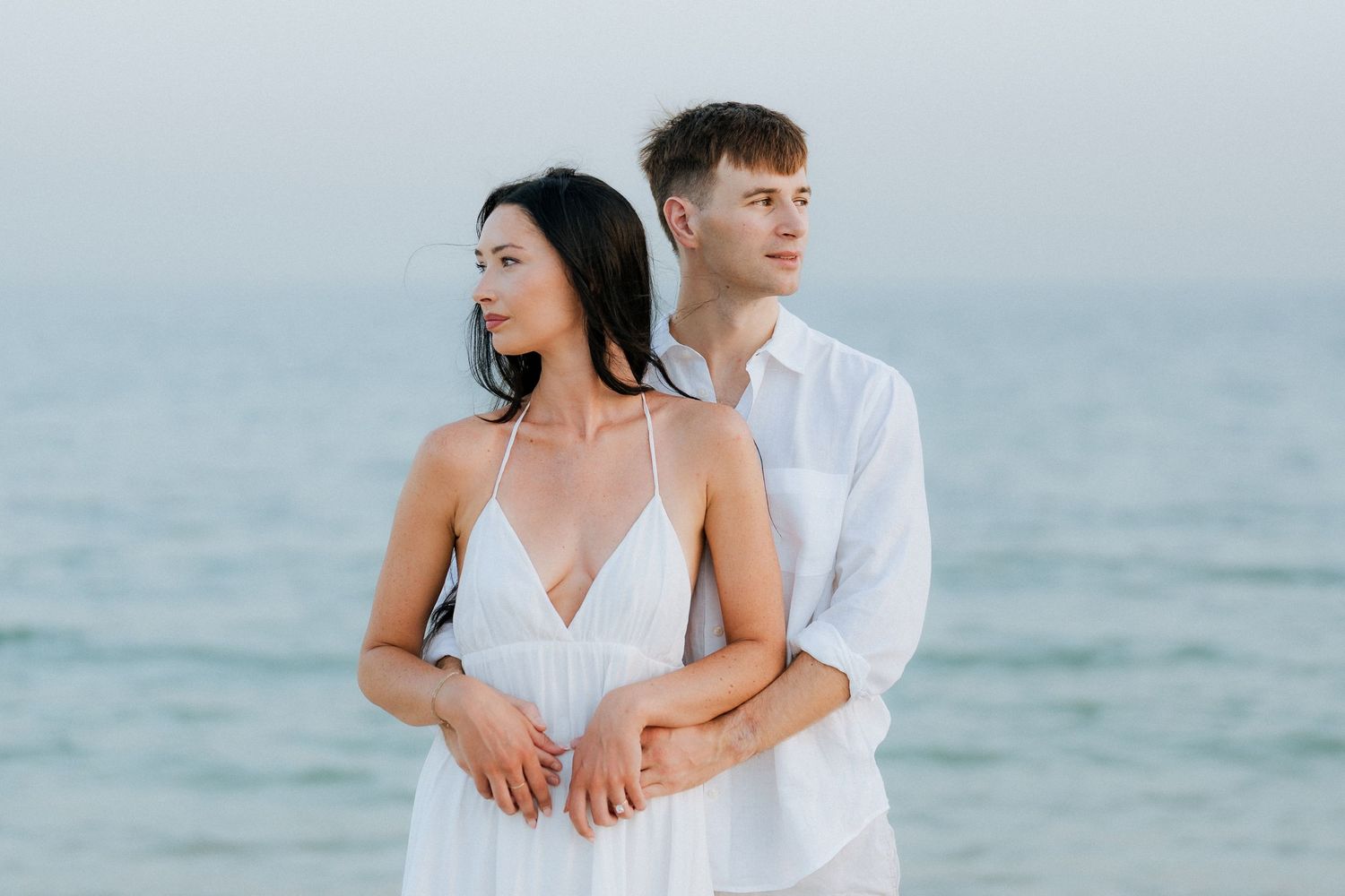Elegant beach couple photoshoot in Dubai with couple standing by the ocean