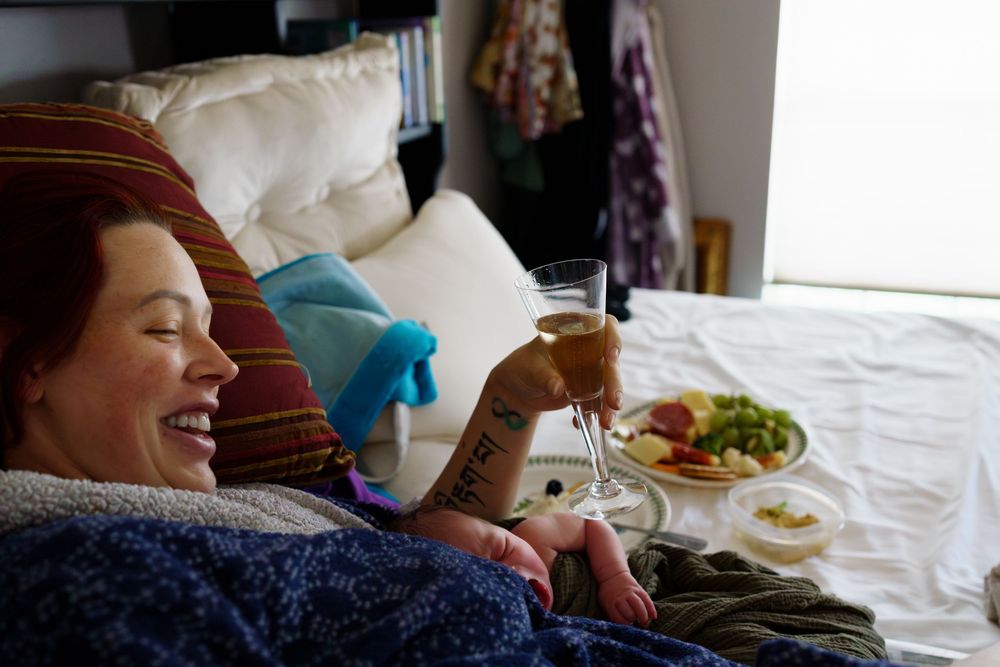 A group enjoying conversation and laughter while dining together at a casual gathering.