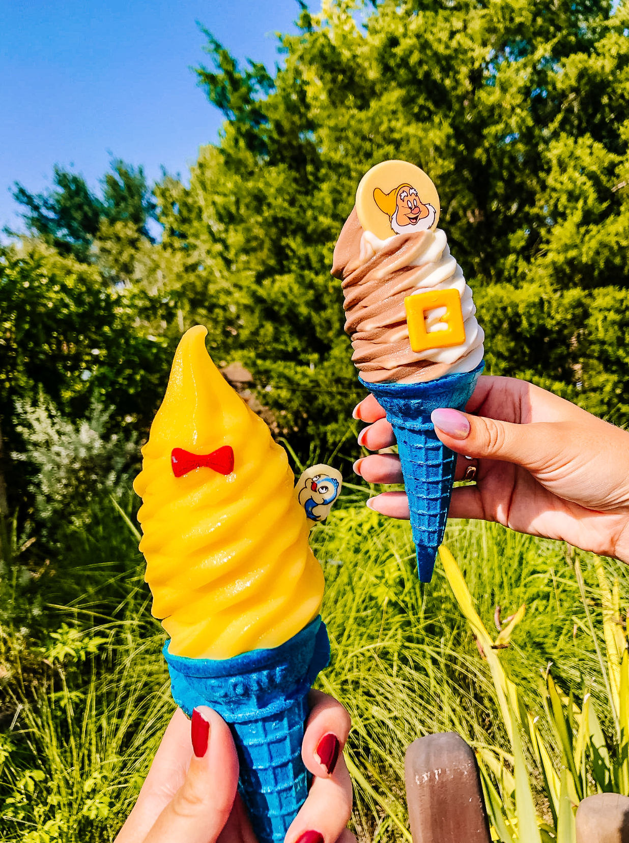 A sequence of photos showing a blue and yellow ice cream cone toy being twisted against a sunny outdoor background.