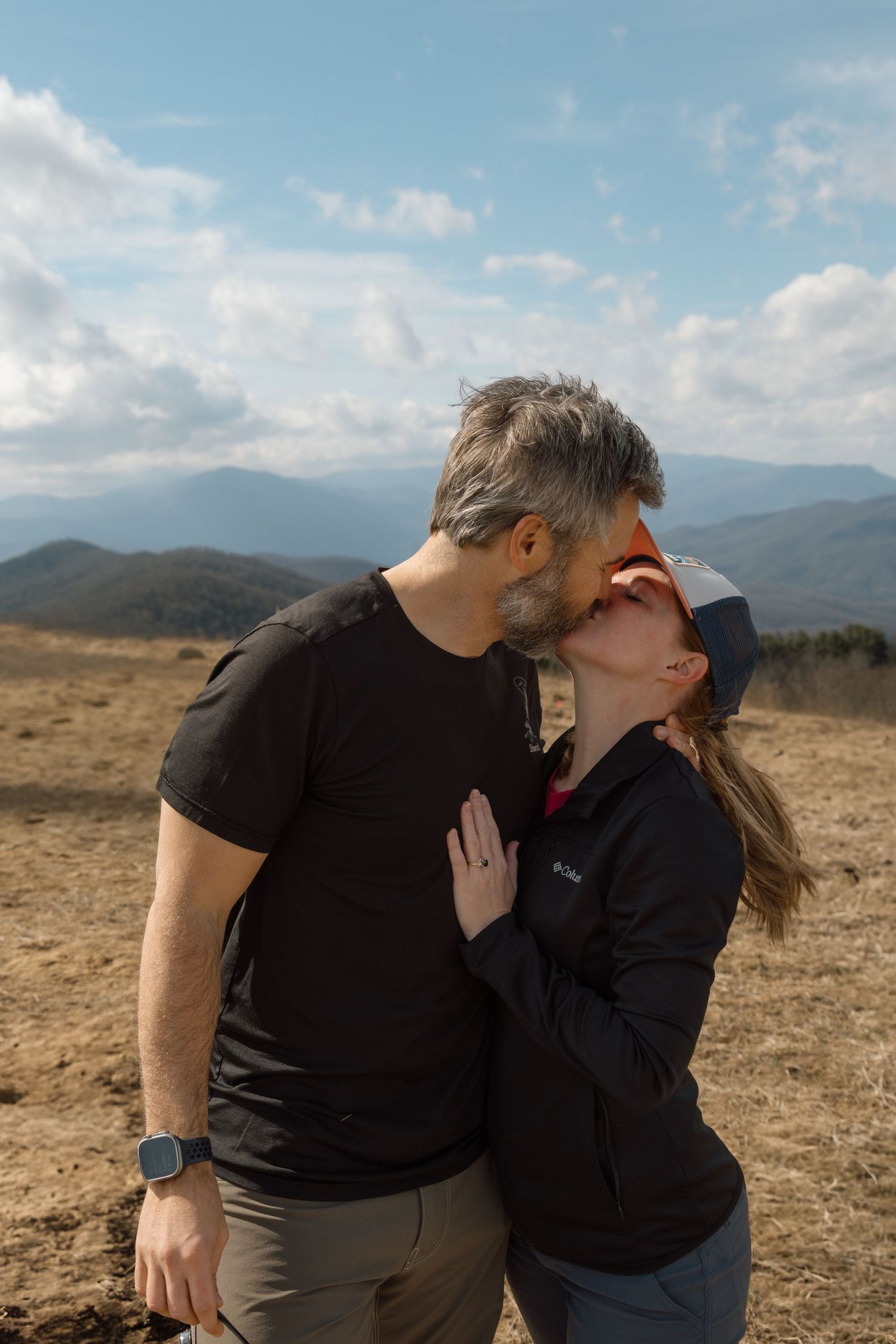 unique couple proposing at blue ridge mountain overlook near Asheville, North Carolina
