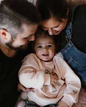 Family sharing tender moment together in intimate close-up shot.
