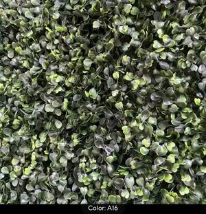Green leaves wall backdrop, creating a lush and natural setting for photo sessions and special events, adding a refreshing touch.