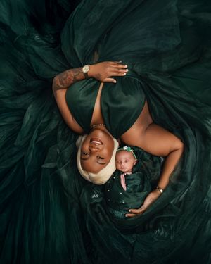 A figure in an emerald green tulle gown poses dramatically against a dark background in a series of artistic portraits.