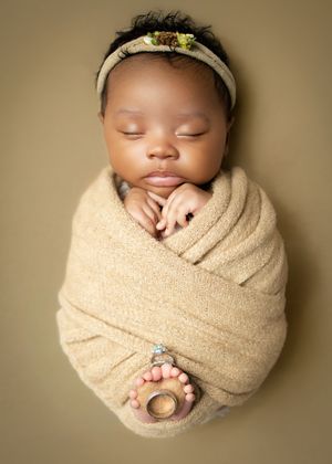 A series of peaceful newborn baby photos showing different angles of a sleeping infant swaddled in beige fabric.