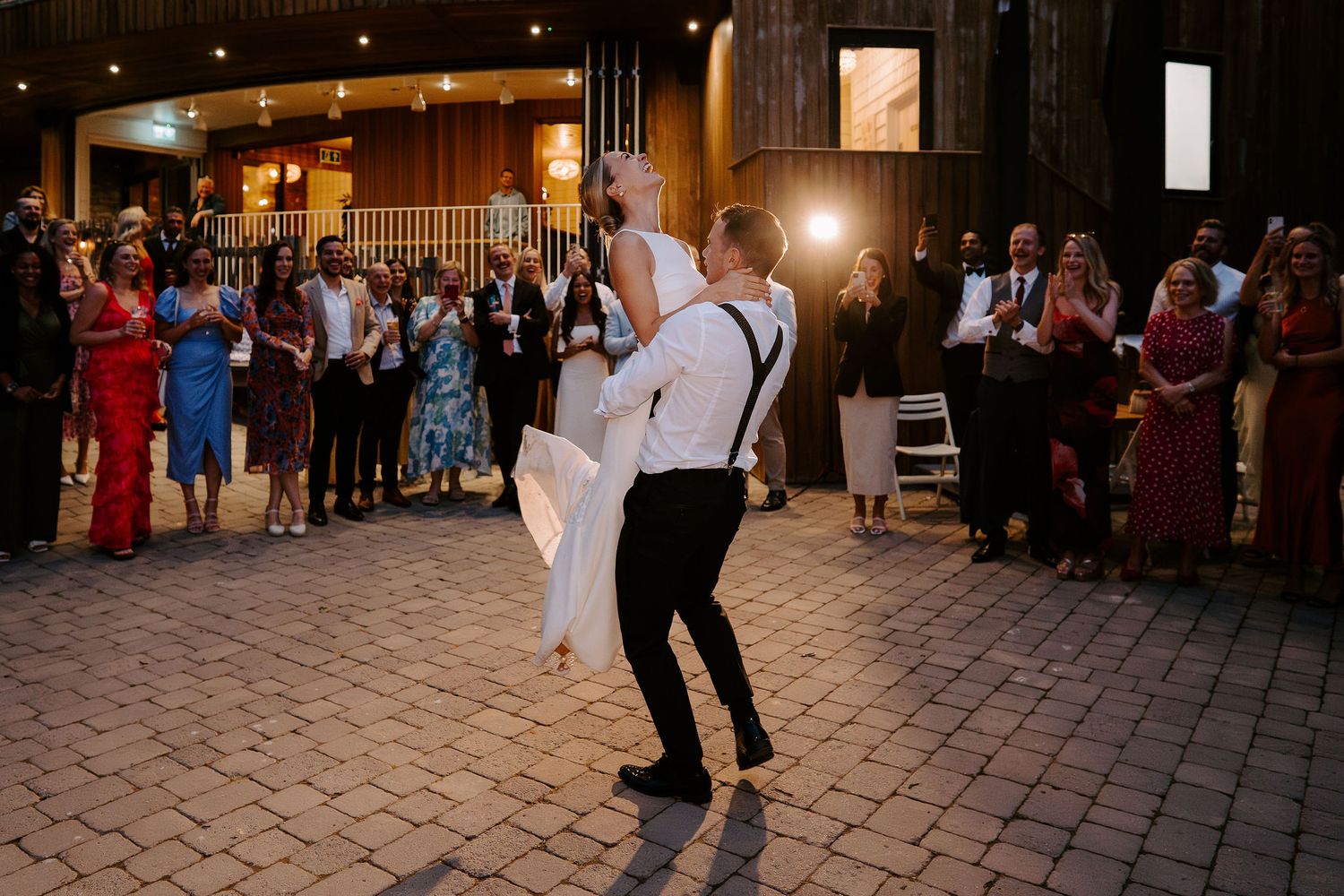 bride and groom doing first dance al fresco at tunnels beach wedding venue in north Devon