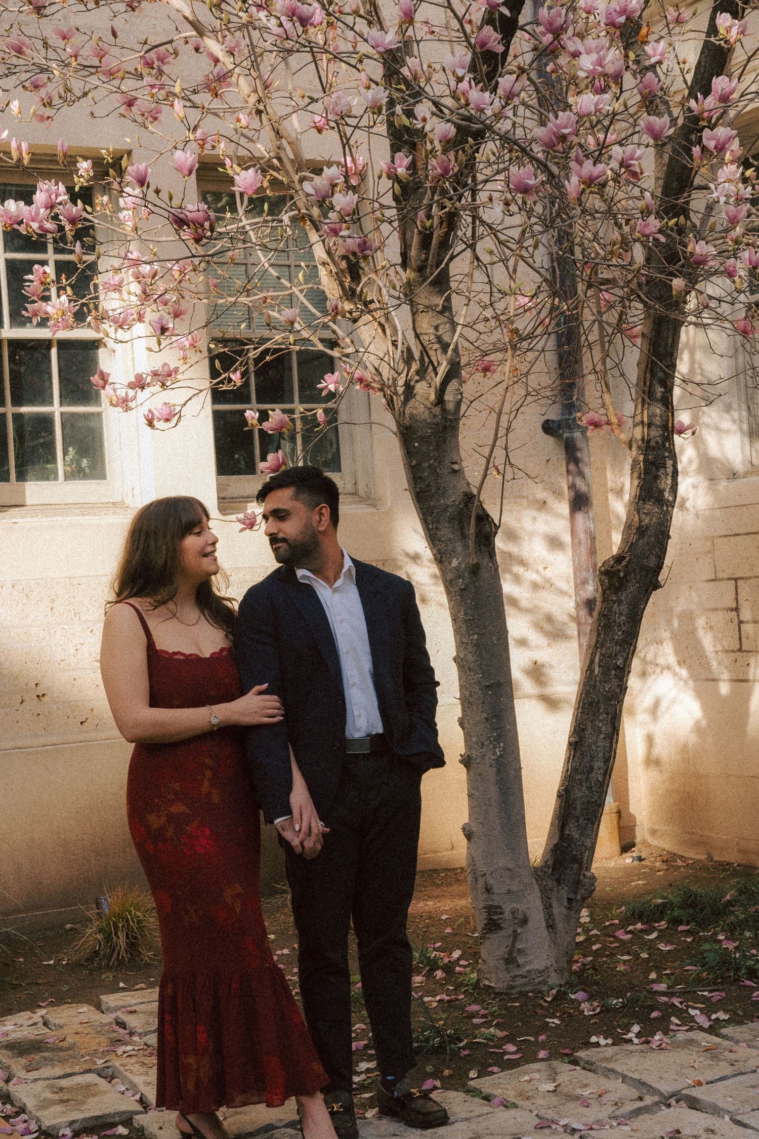 University of Texas at Austin engagement photography. Cherry blossom tree.