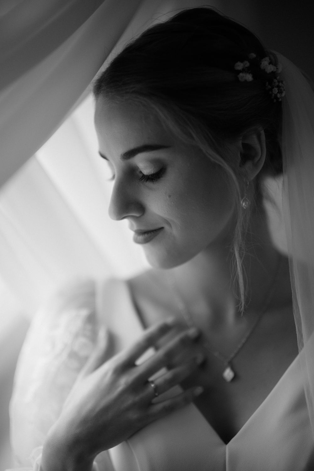 A dreamy black and white portrait sequence showing a side profile in soft, ethereal lighting.
