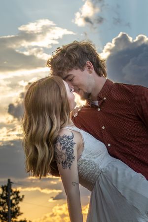 Joey and Trinity share a heartfelt moment, glowing with love and connection in a beautifully captured couples portrait session.