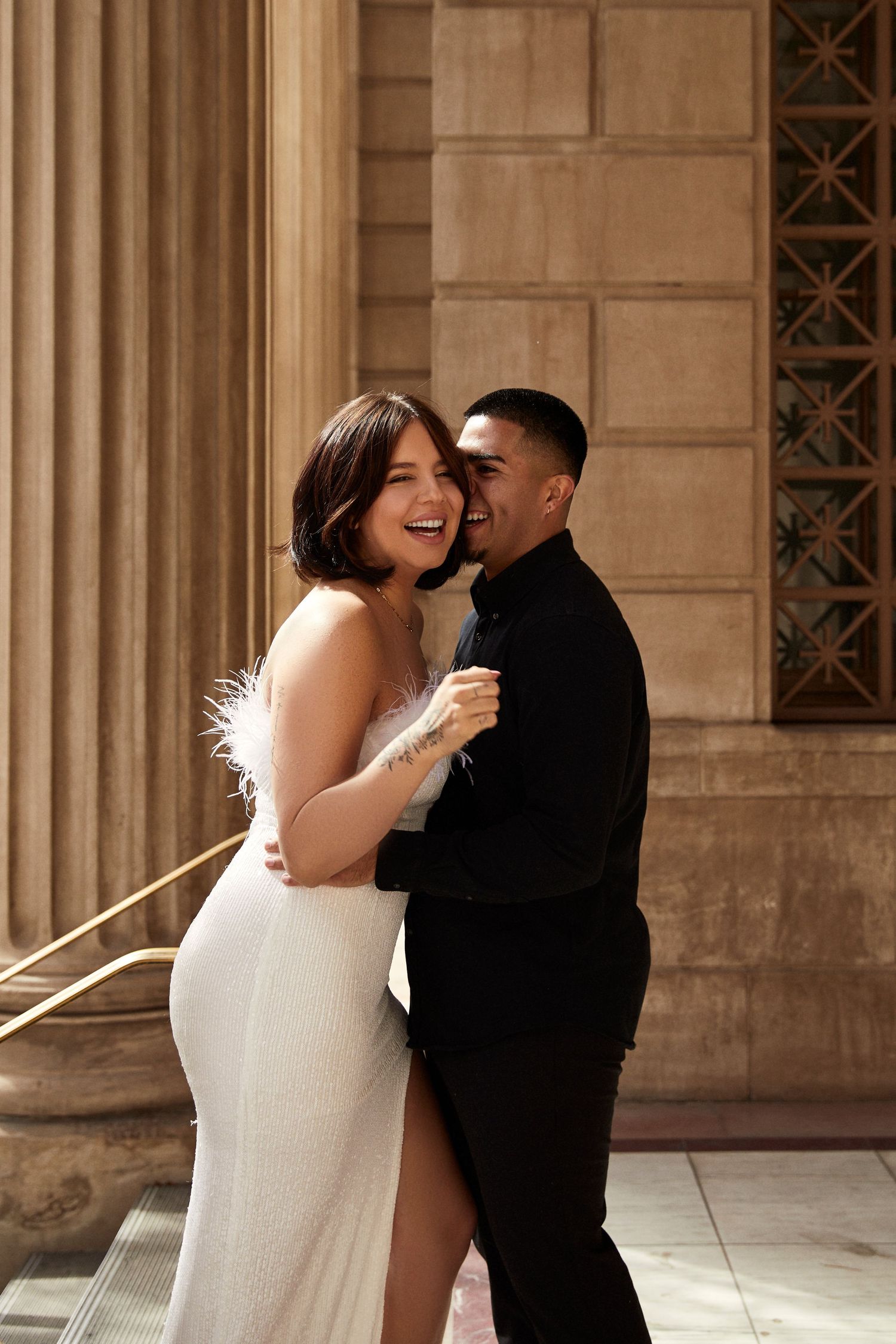 Romantic couple shares intimate moments in a series of photos against a stone column backdrop.