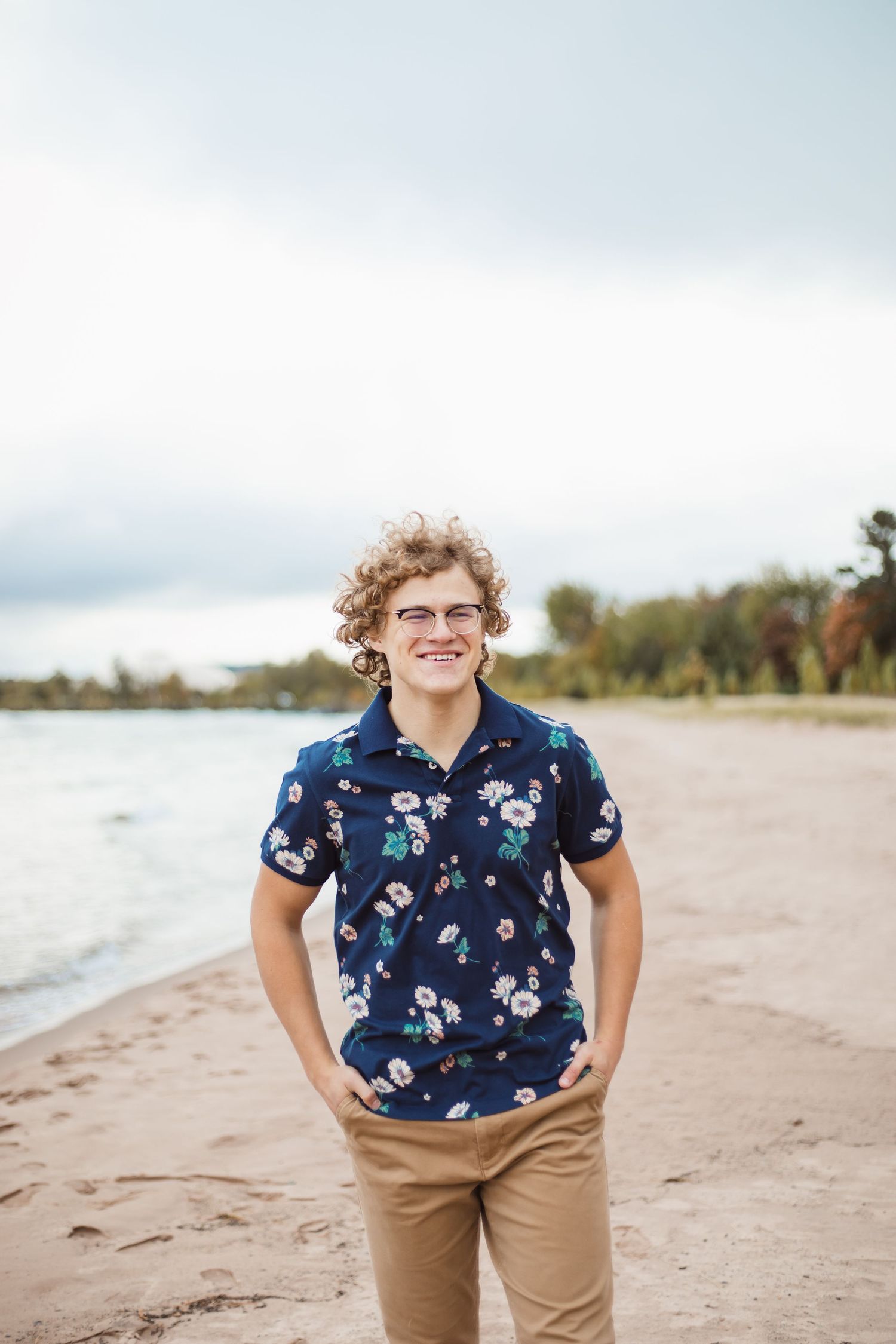High school senior photo, guy, beach, Lake Superior, Marquette, Michigan.