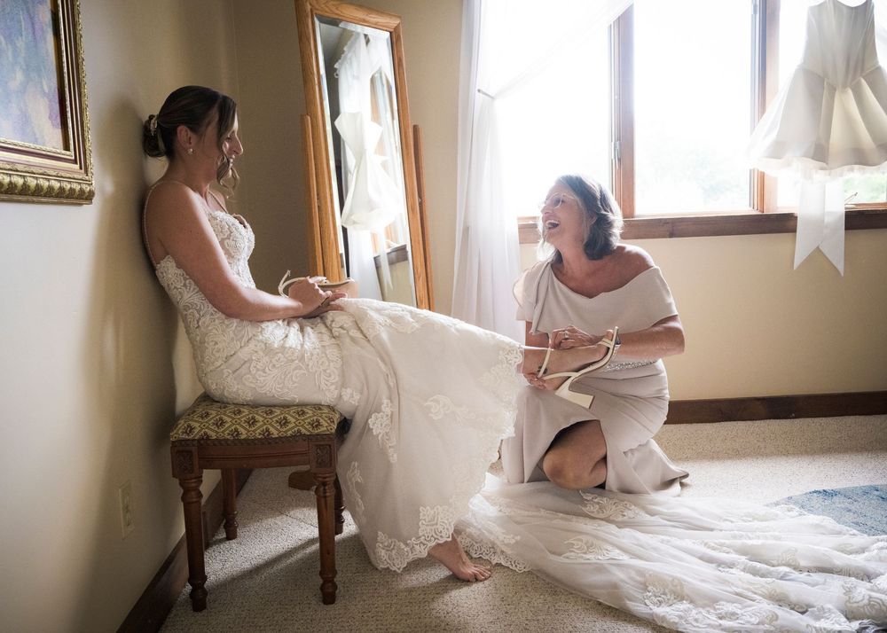 A series of bridal preparation moments showing the bride getting ready in a sunlit room with white wedding dress details.