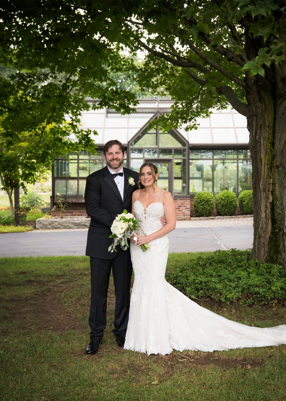 A series of romantic wedding photos showing a couple posing among trees in a garden setting.