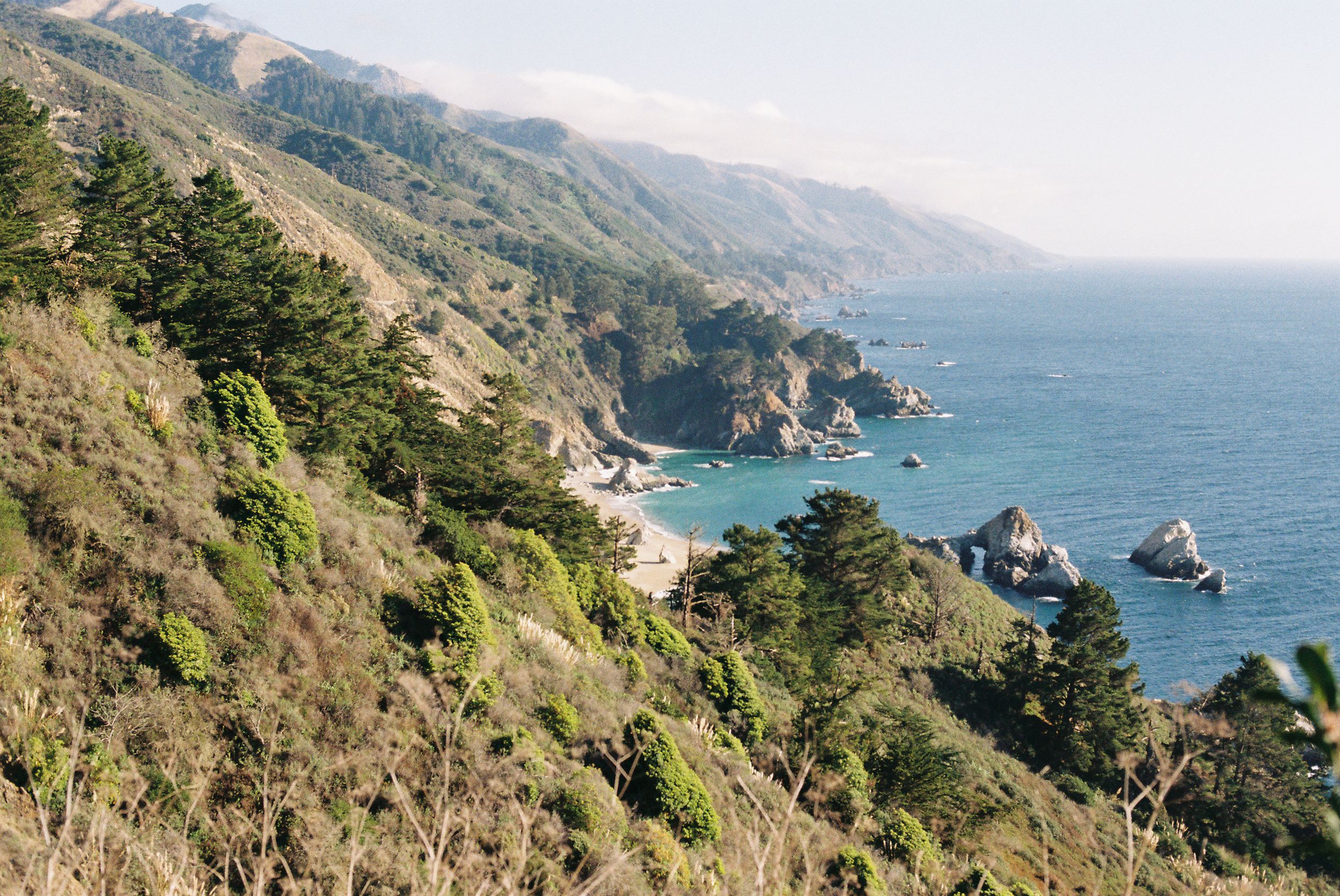 Scenic Big Sur coastline with dramatic cliffs overlooking the Pacific Ocean.