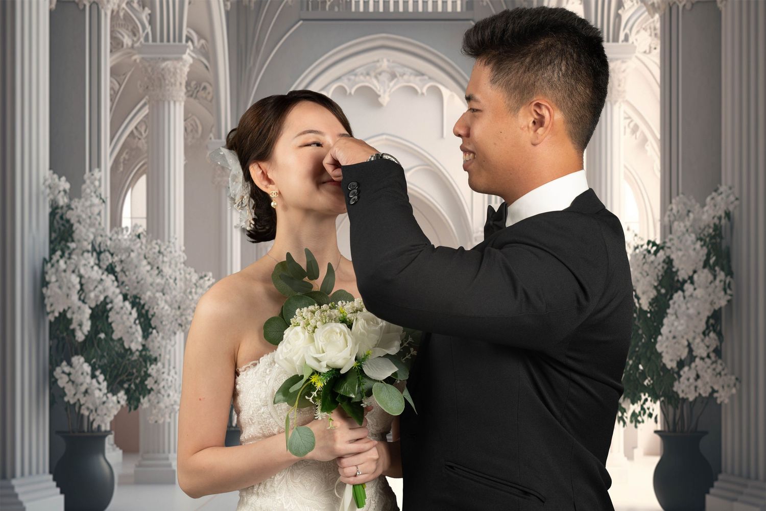A romantic wedding portrait captured in an elegant white decorated venue.