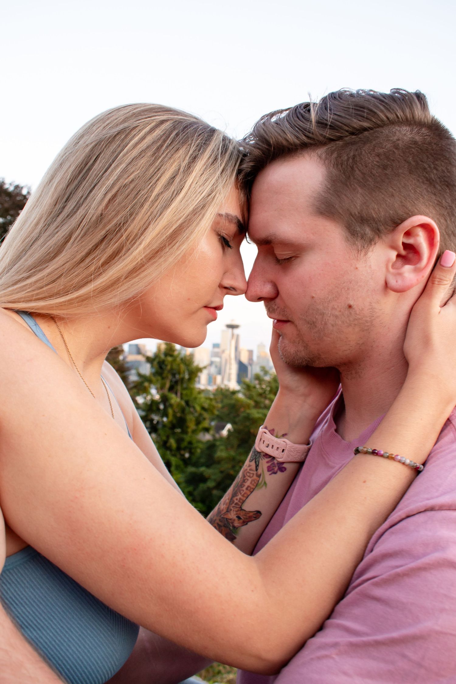Romantic golden hour couple photo in Seattle, perfect for engagement sessions or couples photography in Kerry Park, Washington.