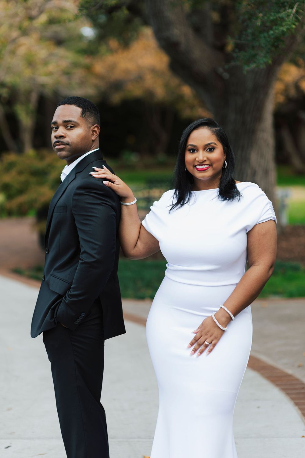 Candid laughter captured in a Dallas Arboretum engagement session