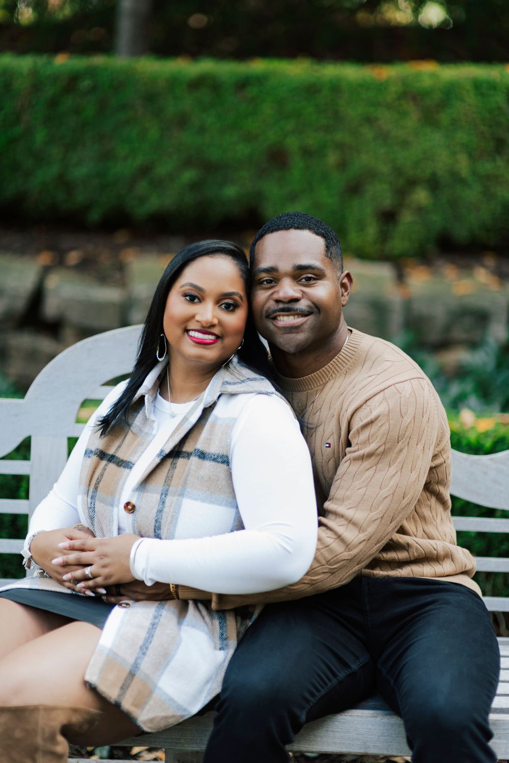 Stylized engagement shoot featuring vibrant garden backdrops