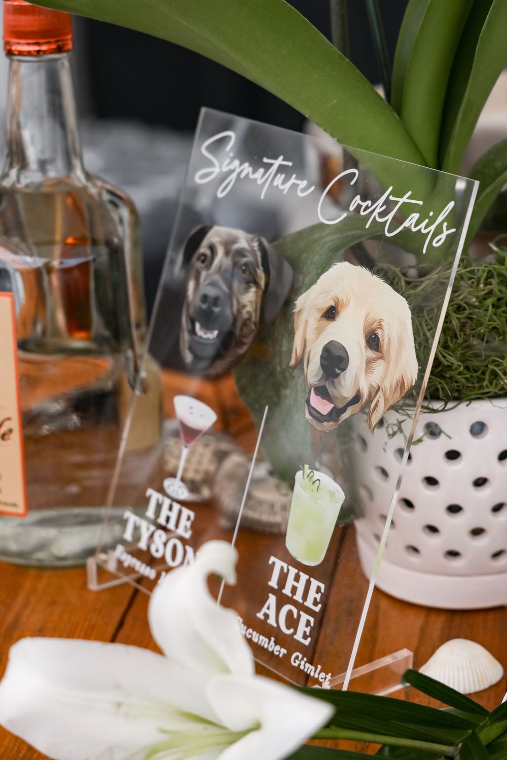 Wedding cocktail menu featuring two dogs named The Ace displayed with bottle and glassware.