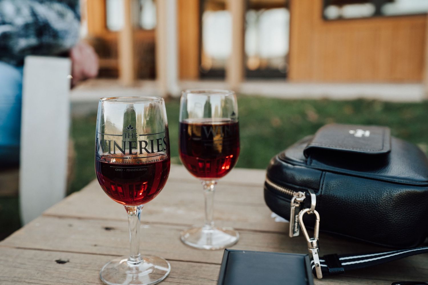 glasses of wine of an engaged couple at The Winery at Hunters Valley